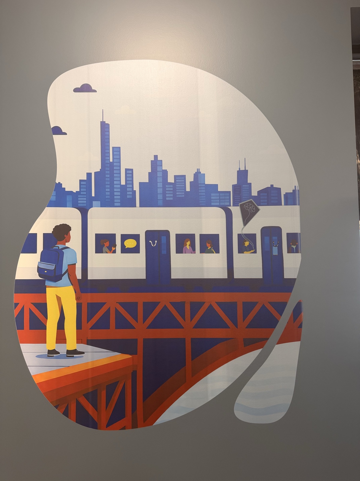 Blue and orange Chicago train illustration printed directly on a light interior wall